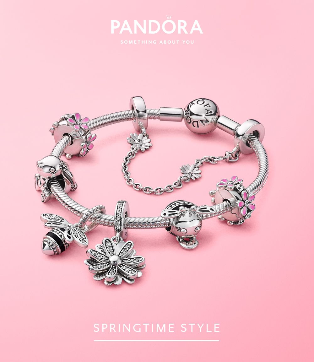 Pandora advertisement of their bracelet for spring collection in pink background.