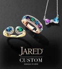 Advertisement of Jared Jewelry for custom pieces which shows two rings and a necklace.