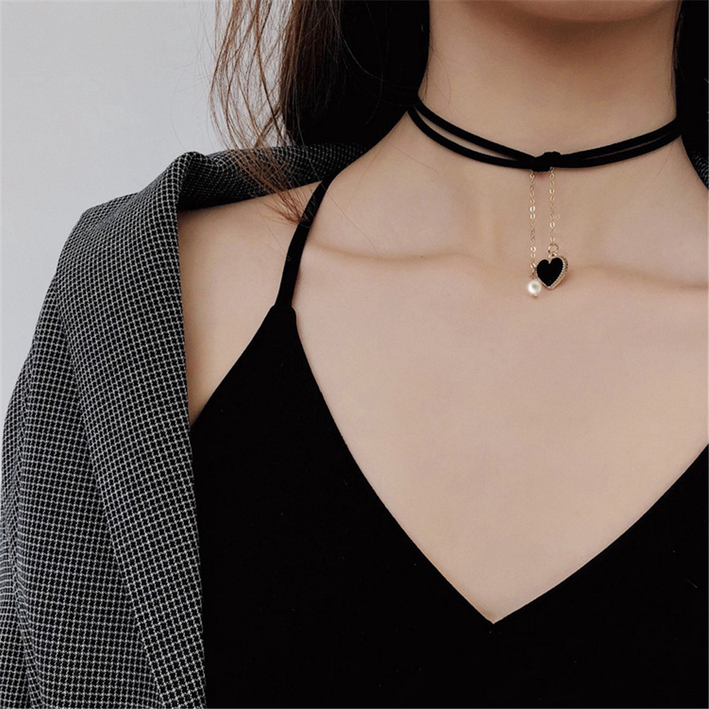 Black heart matte pendant hanging with black string