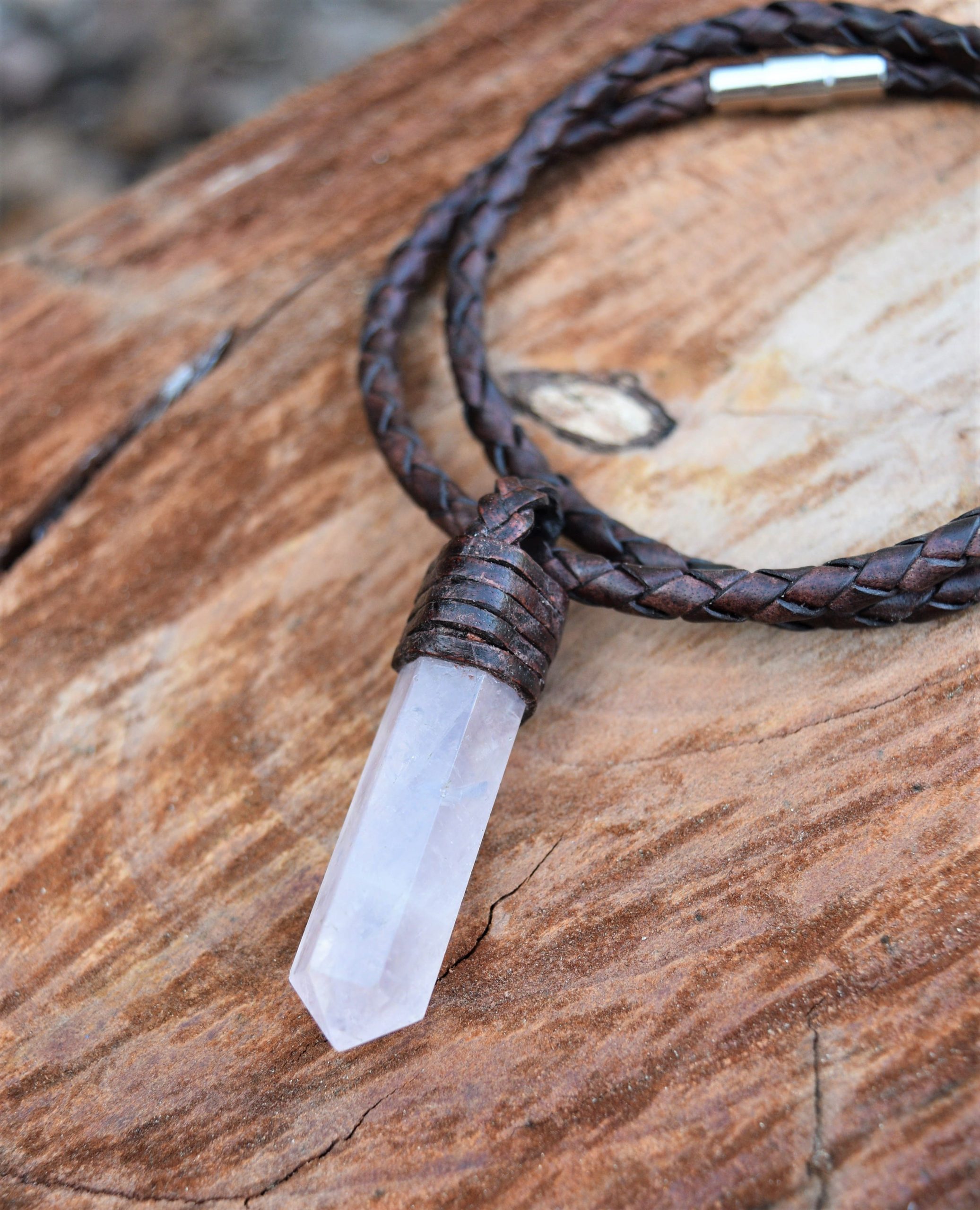 Pointed rose quartz stone with leather lace