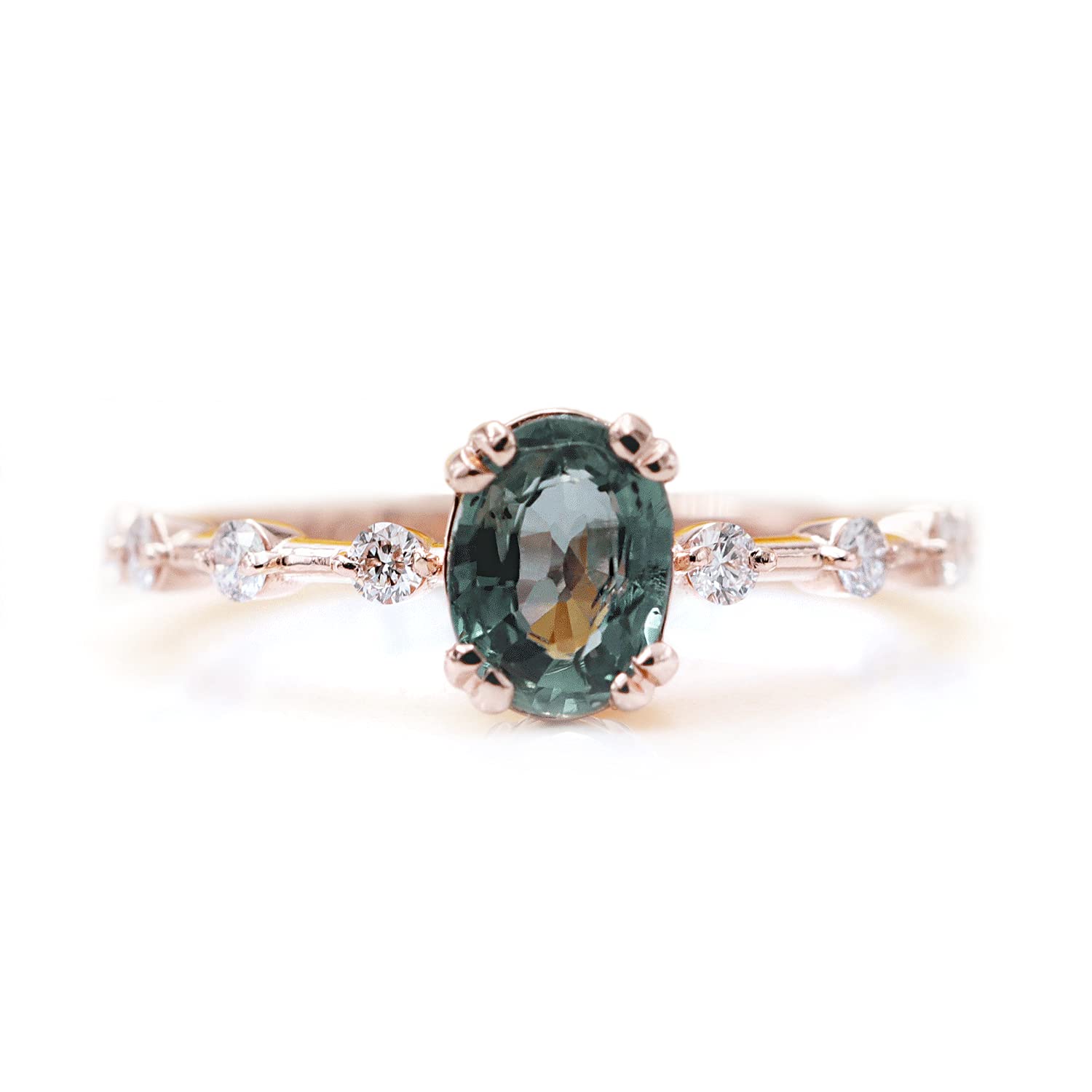 Dazzling green sapphire stone with six diamond beads in the body