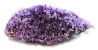 The Grape Agate stone is filled with mini round purple agate stones on a white background