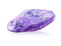 The shiny Charoite stone has a mix of white and violet colors on a white background