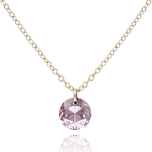 A large round Alexandrite pendant is attached to silver lace on a white background