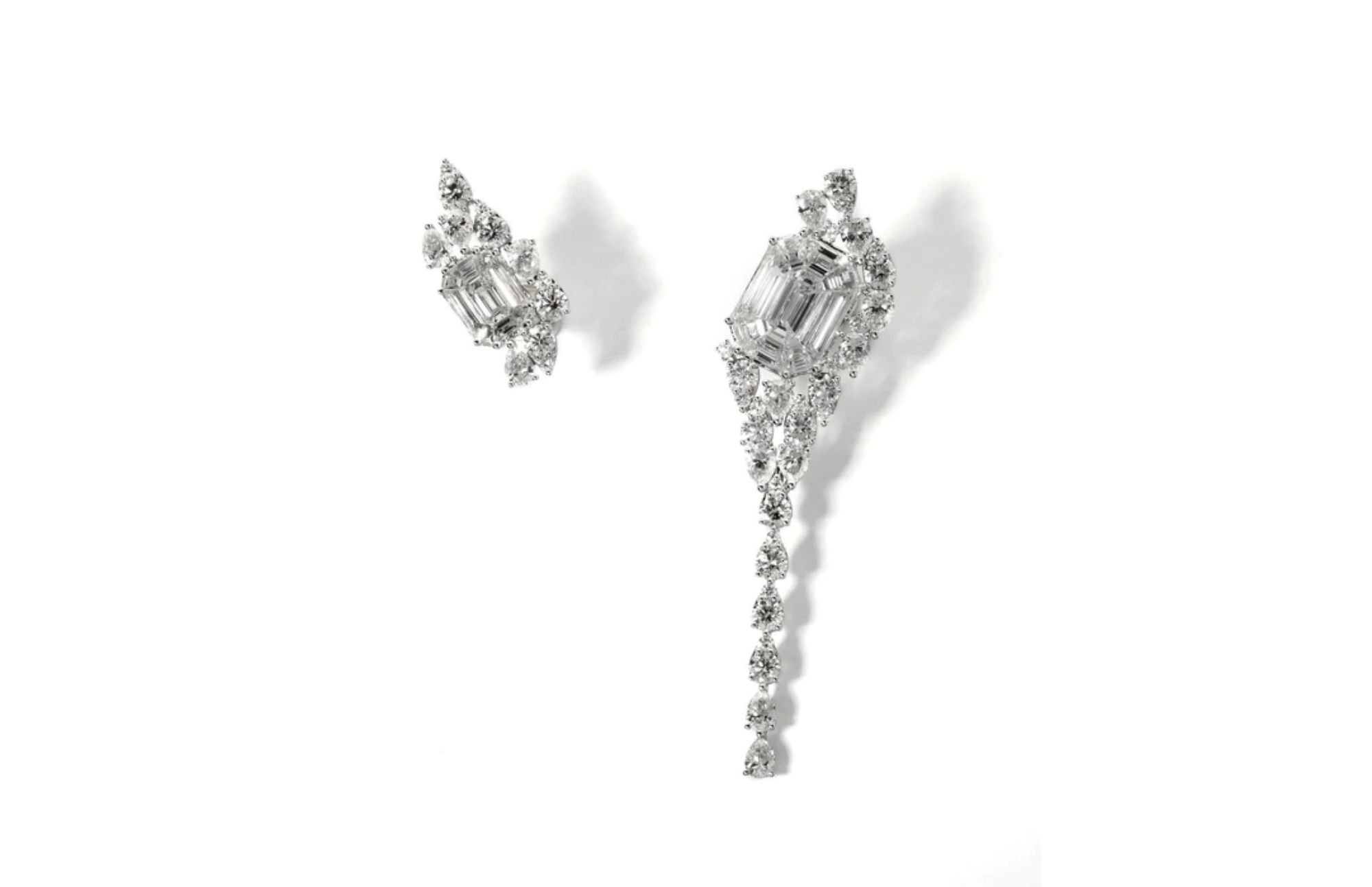 Long-tailed asymmetrical earring paired with small illusion diamond earring