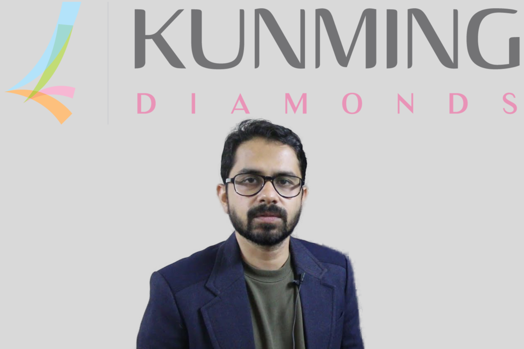 Rahul Jauhari's background features the Kunming diamond logo