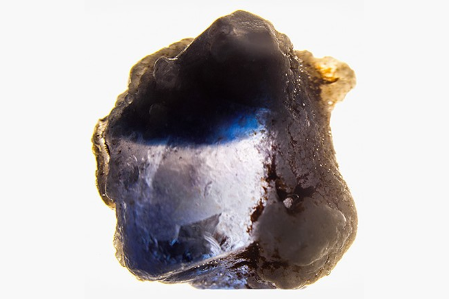 6.21 ct laboratory-grown sapphire with curved blue banding visible in water