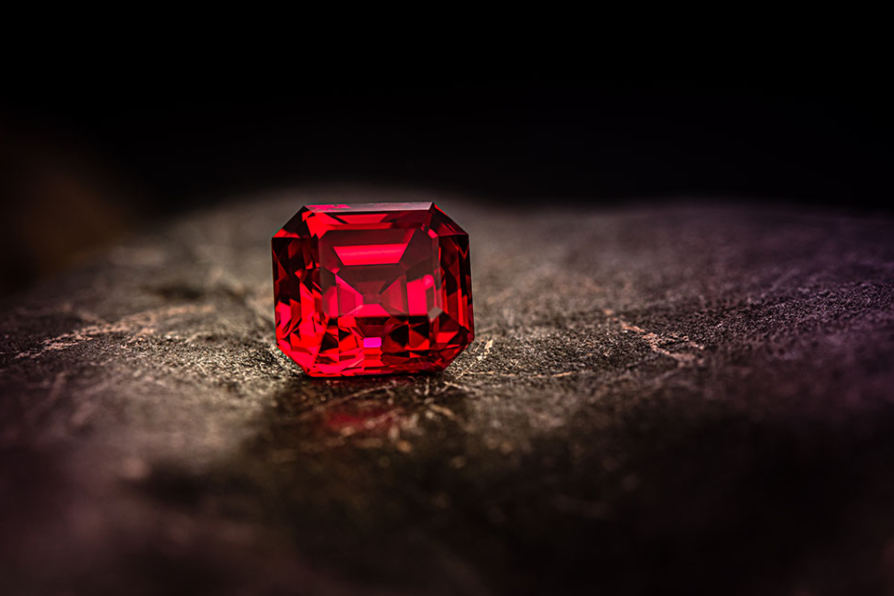 An octagonal ruby in a dark 