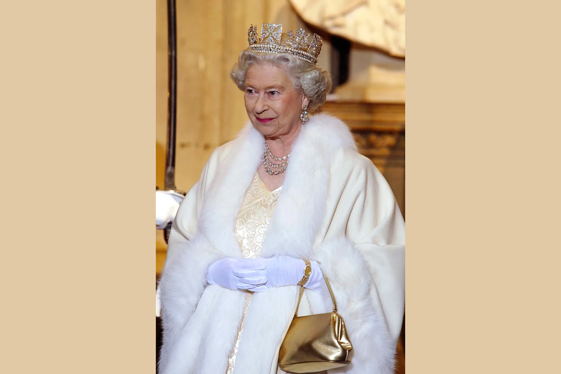 Queen Elizabeth II dressed in glorious attire and the State Diadem
