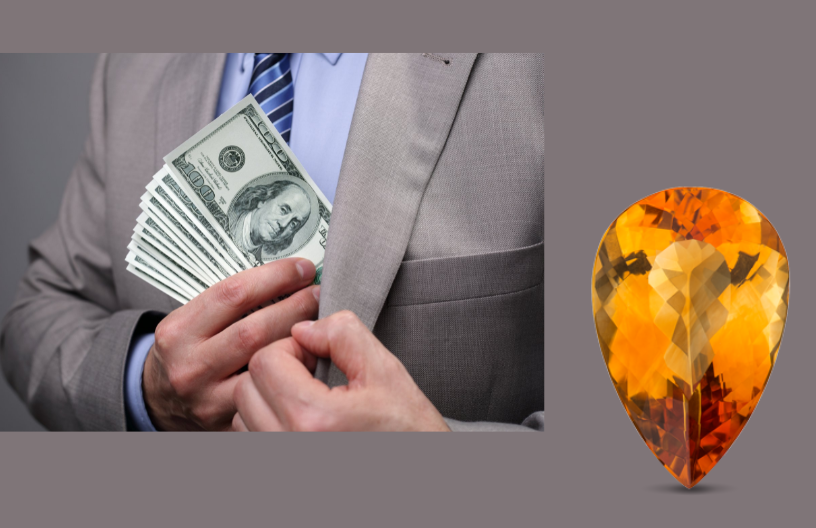 A citrine gemstone and a successful businessman holding his money