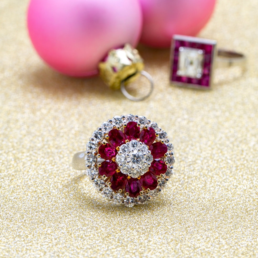 A stunning diamond in the center of the ring and surrounded by real burmese rubies