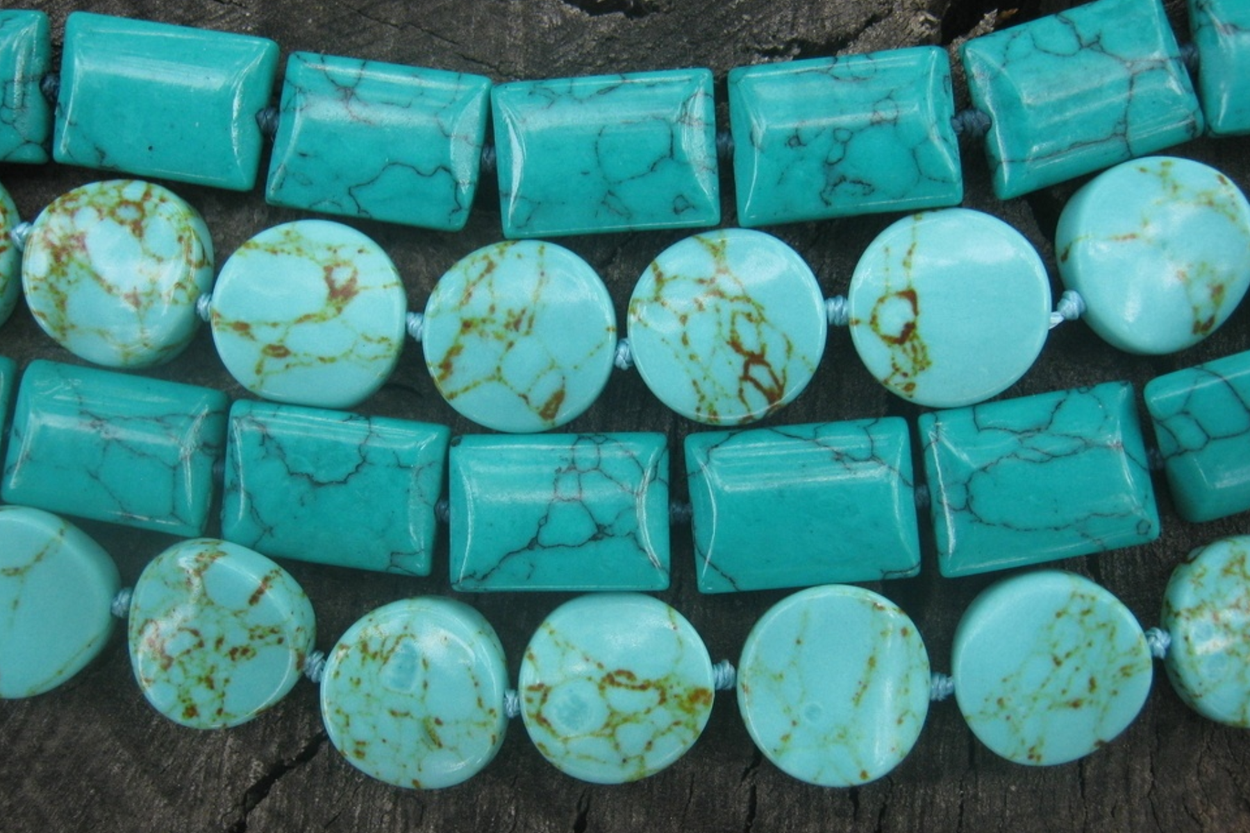 Turquoise beads on a variety of necklaces