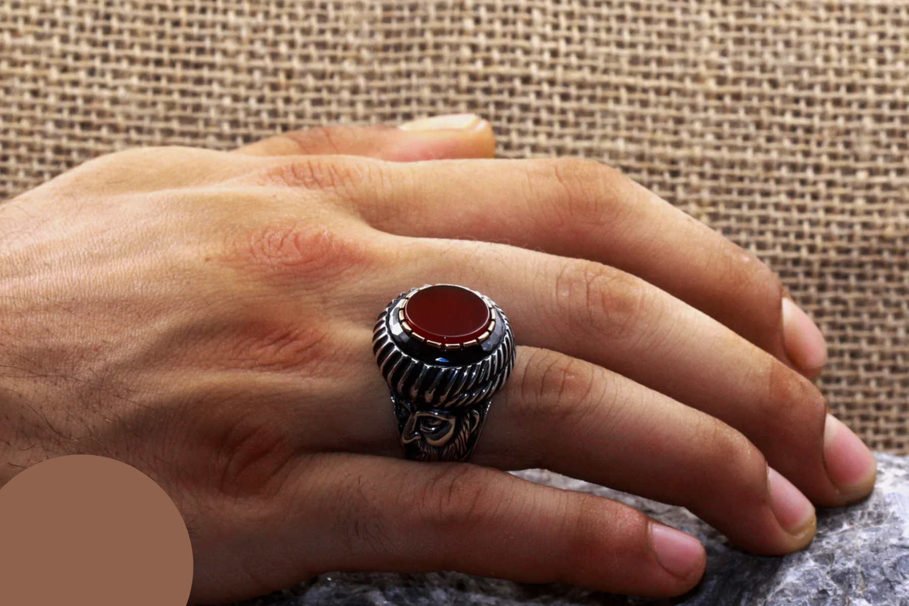 Agate stone ring on a man's ring finger