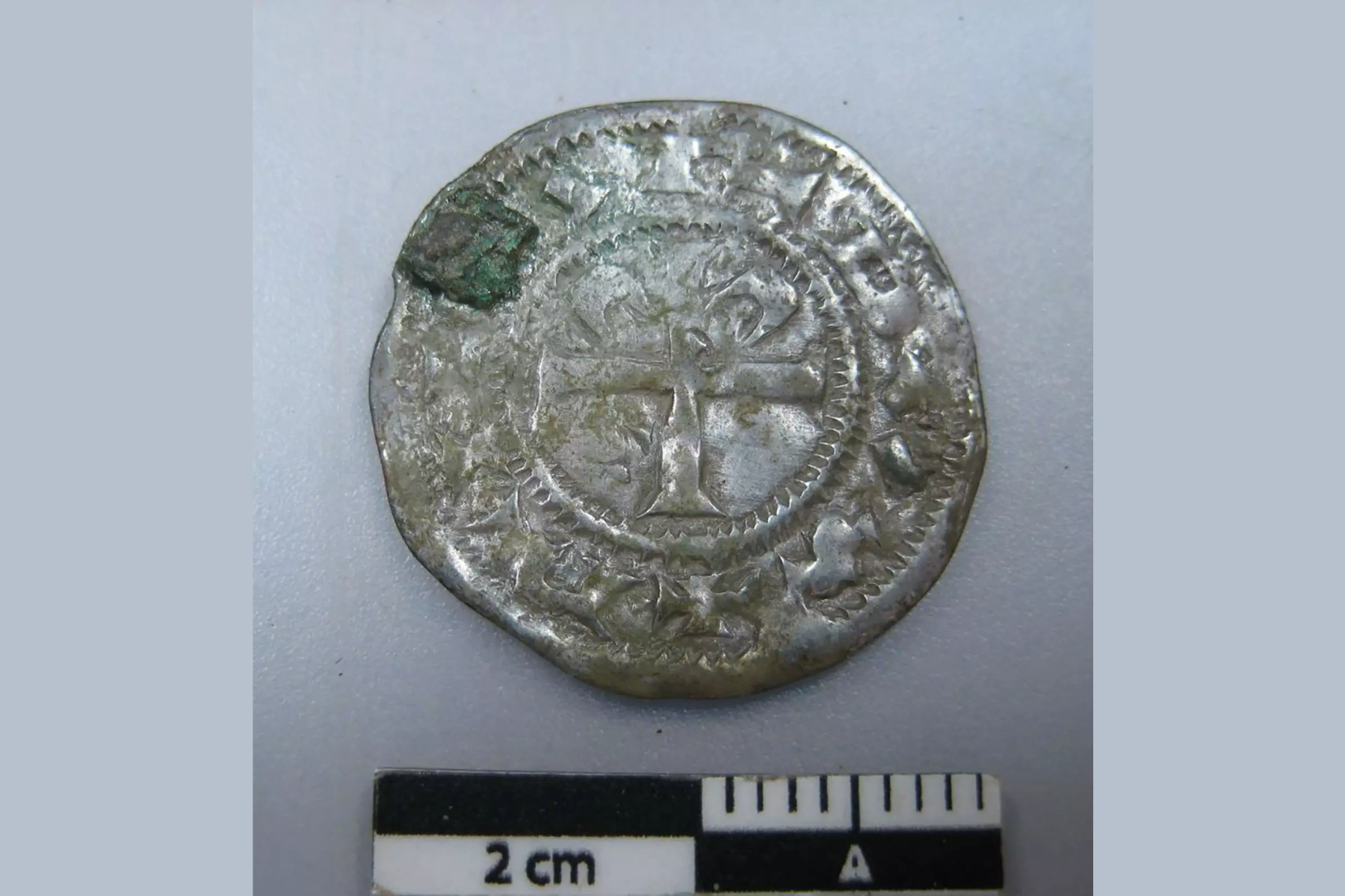A Viking coin measuring 2 cm in length
