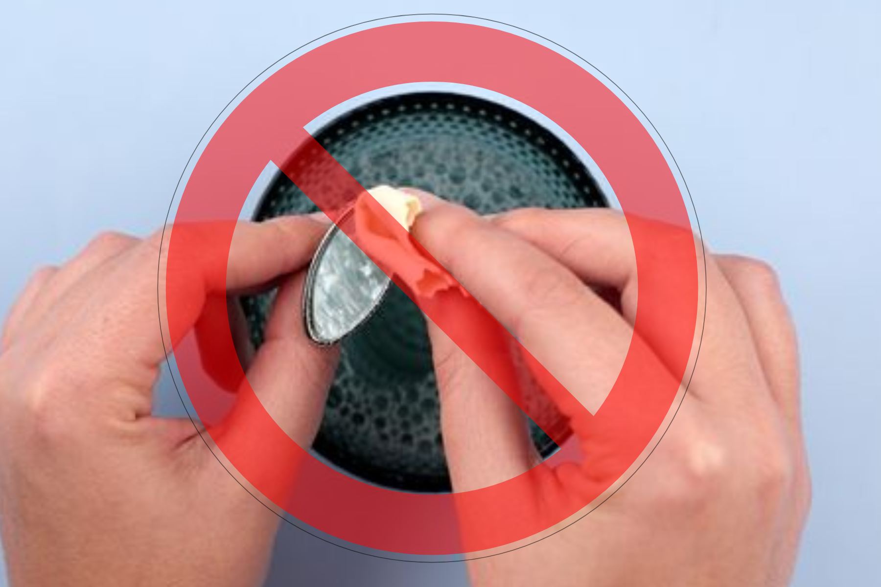 A woman uses water with a warning notice to clean an opal ring