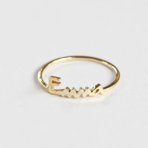 Centime custom gold stacking ring with the name Emma on it