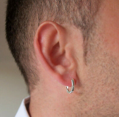A man wearing a small hoop silver earring