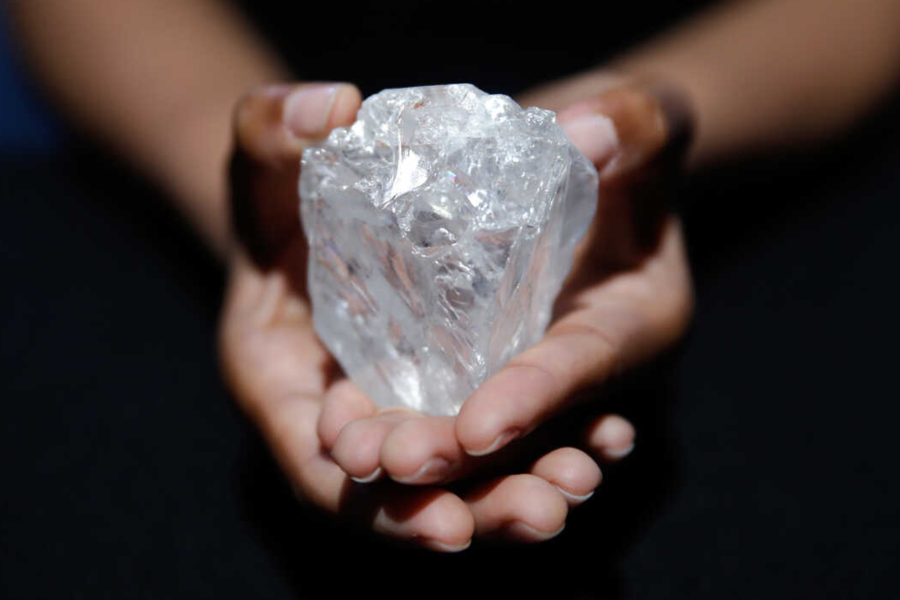 A massive uncut diamond on a hand
