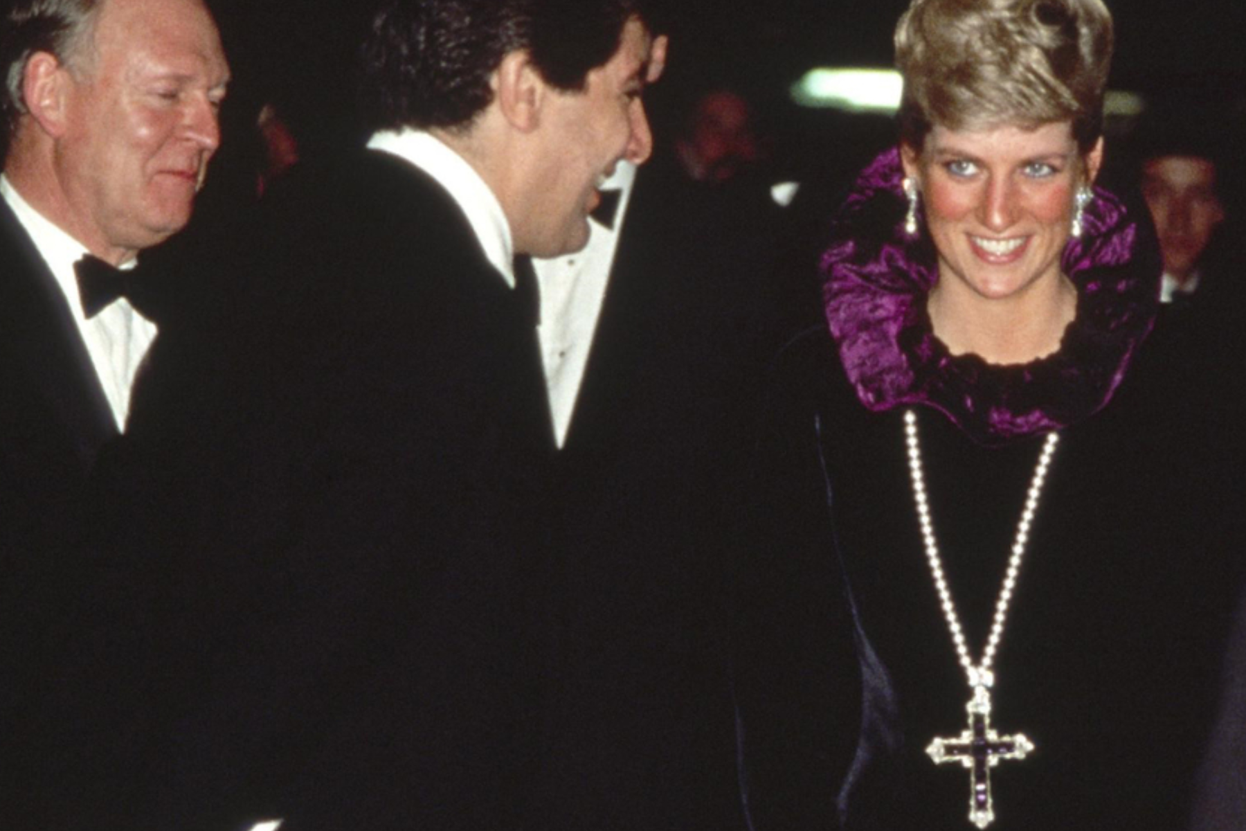 Princess Diana wearing the Garrard amethyst and diamond cross pendant to a charity event in 1987