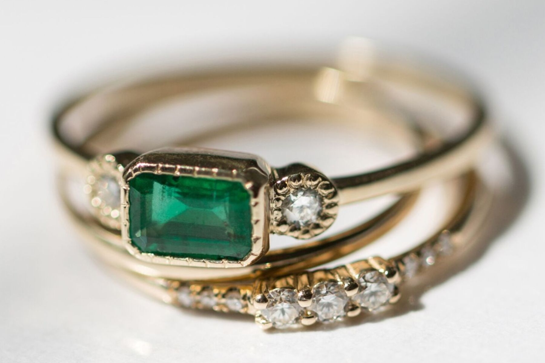 Rings with an emerald and diamonds