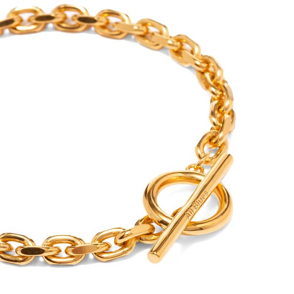 The All Blues Anchor Bracelet has a gold chain and a lock feature
