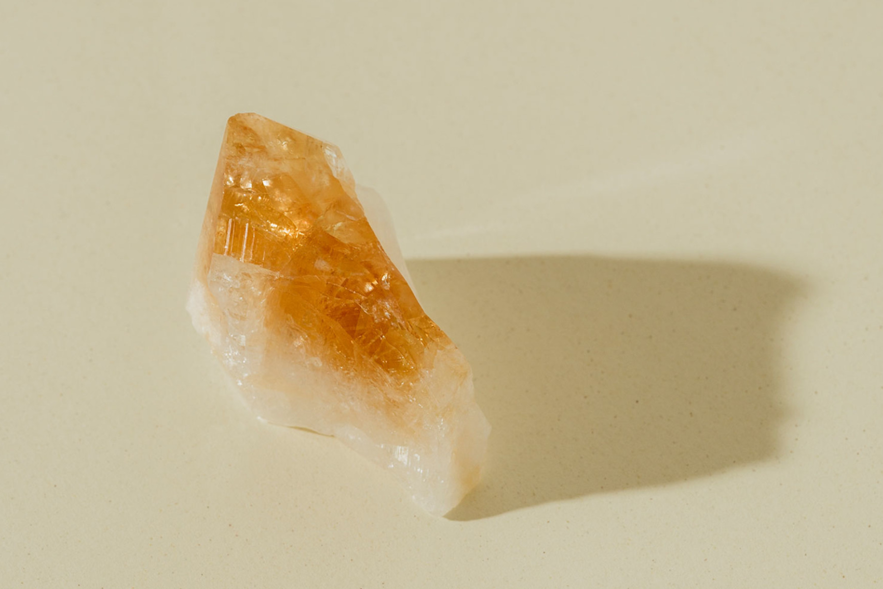 Citrine crystal cast a shadow in front of the light