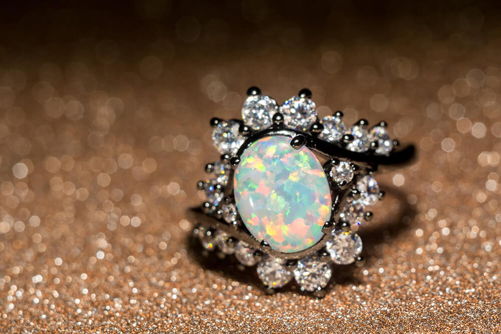 Ring with opal and diamond accents