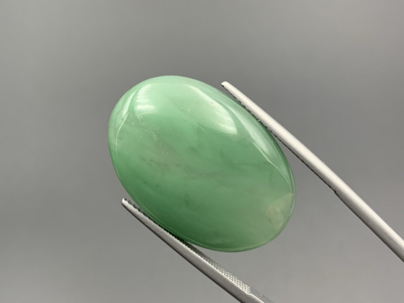 Aventurine in the shape of an oval on a prong