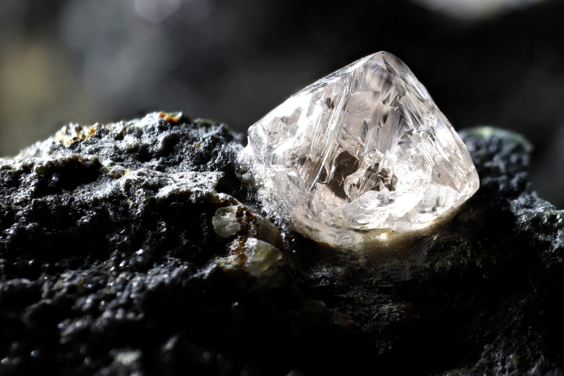 A rough diamond atop a rock