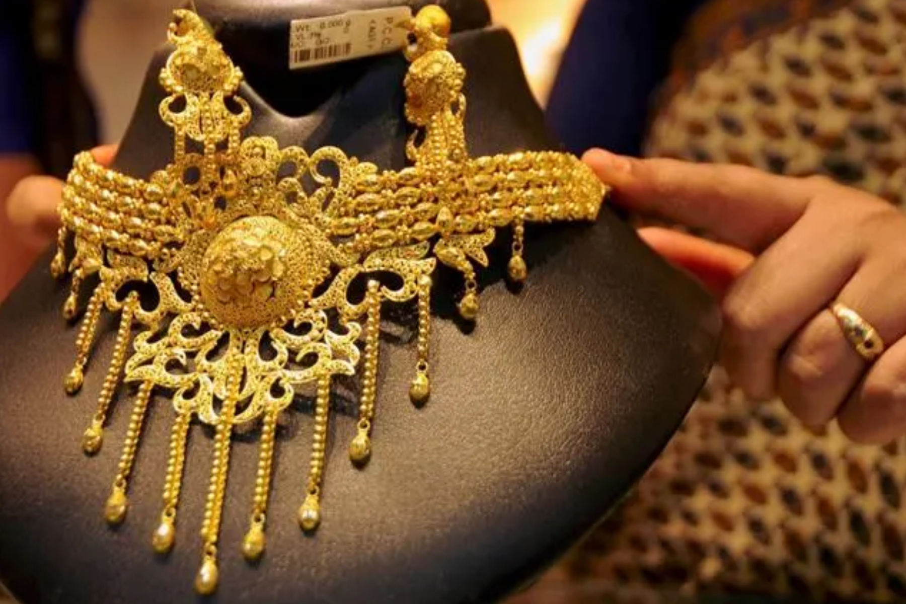 A gold necklace with extremely detailed structures