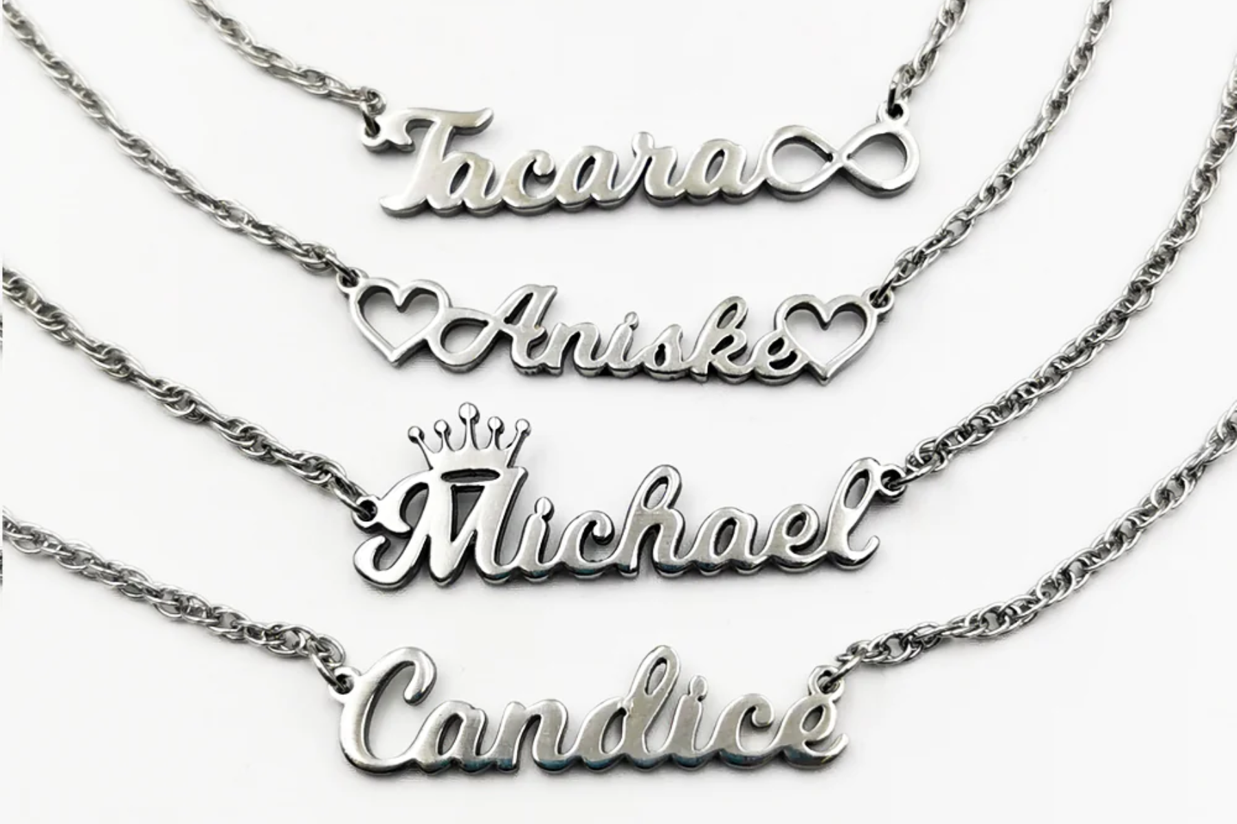 Four personalized necklaces bearing different names