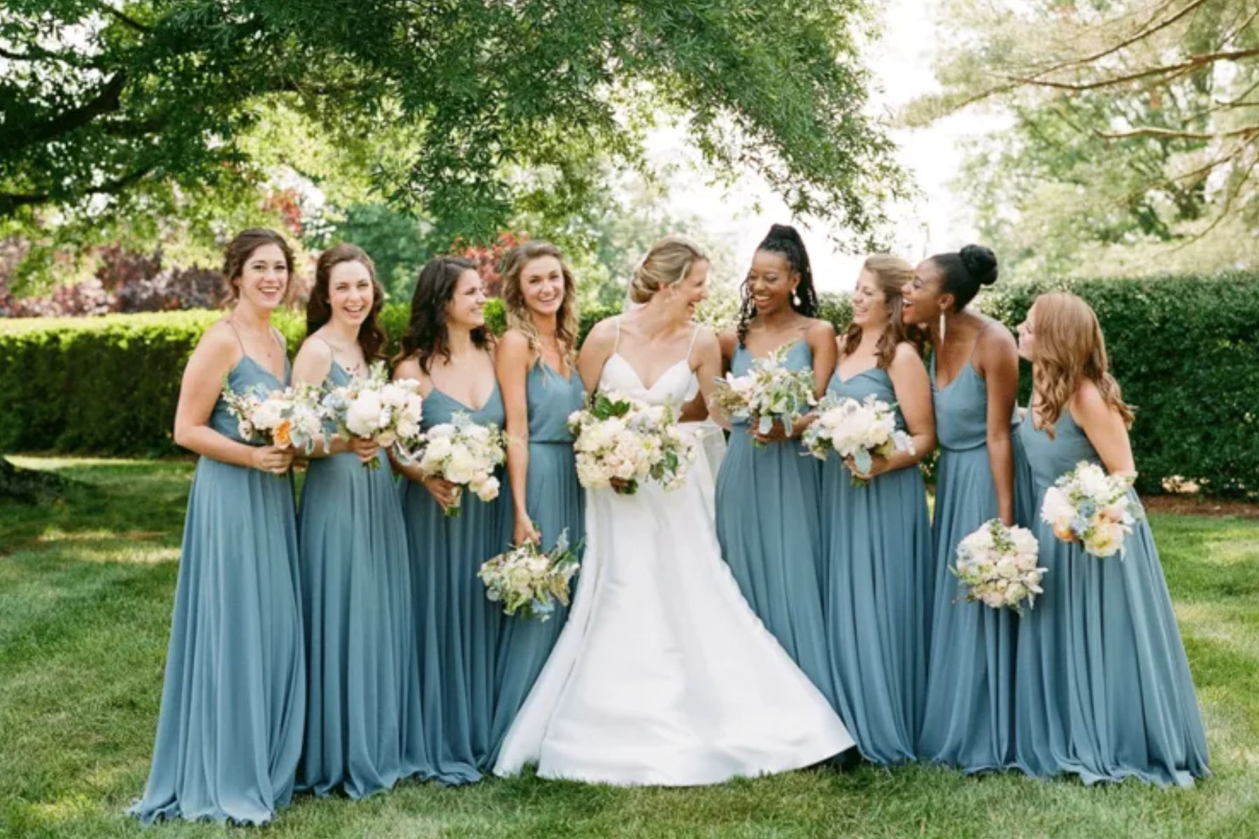 A bride and her bridesmaids in the garden