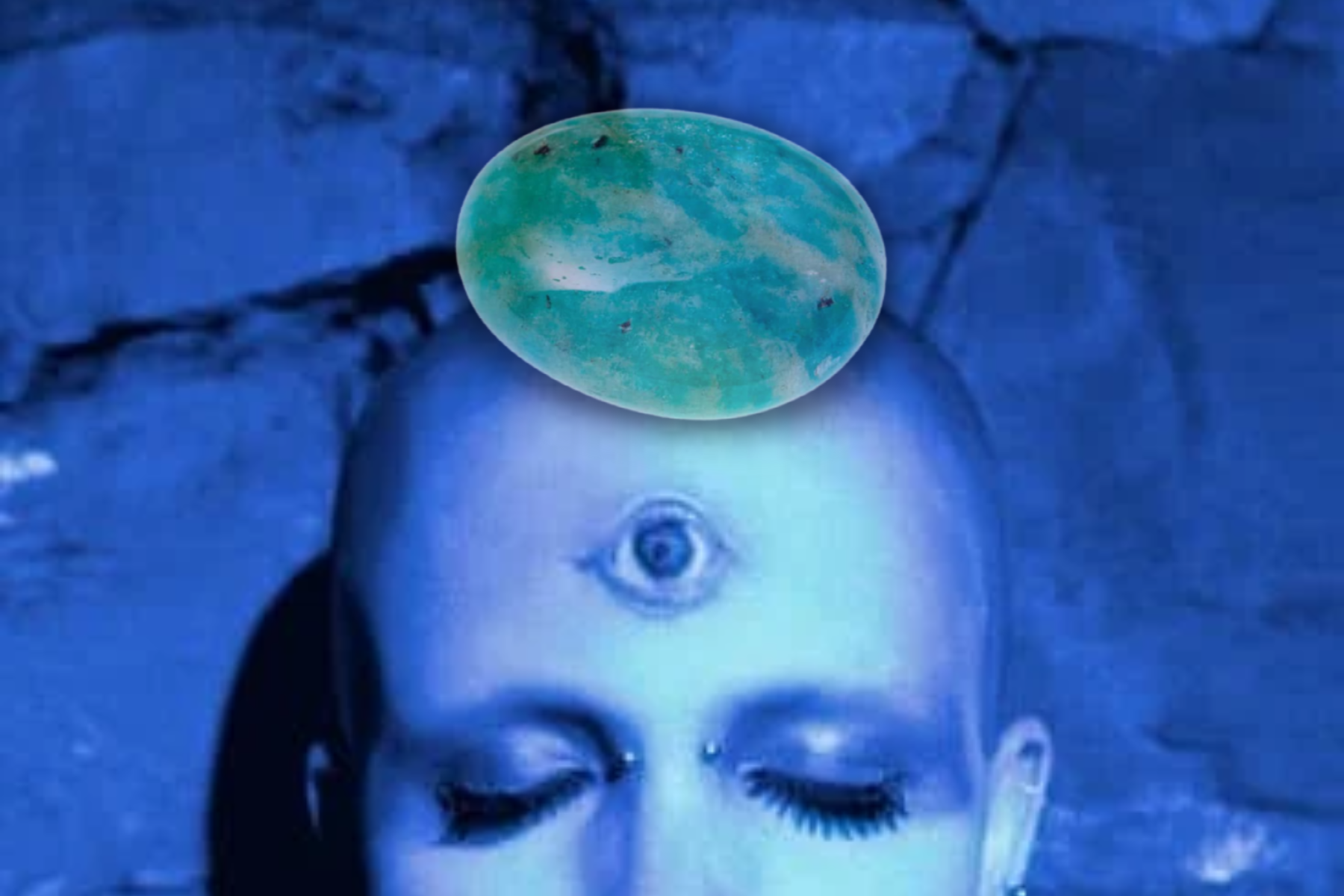 A bald woman with a third eye and a stone of amazonite on her head