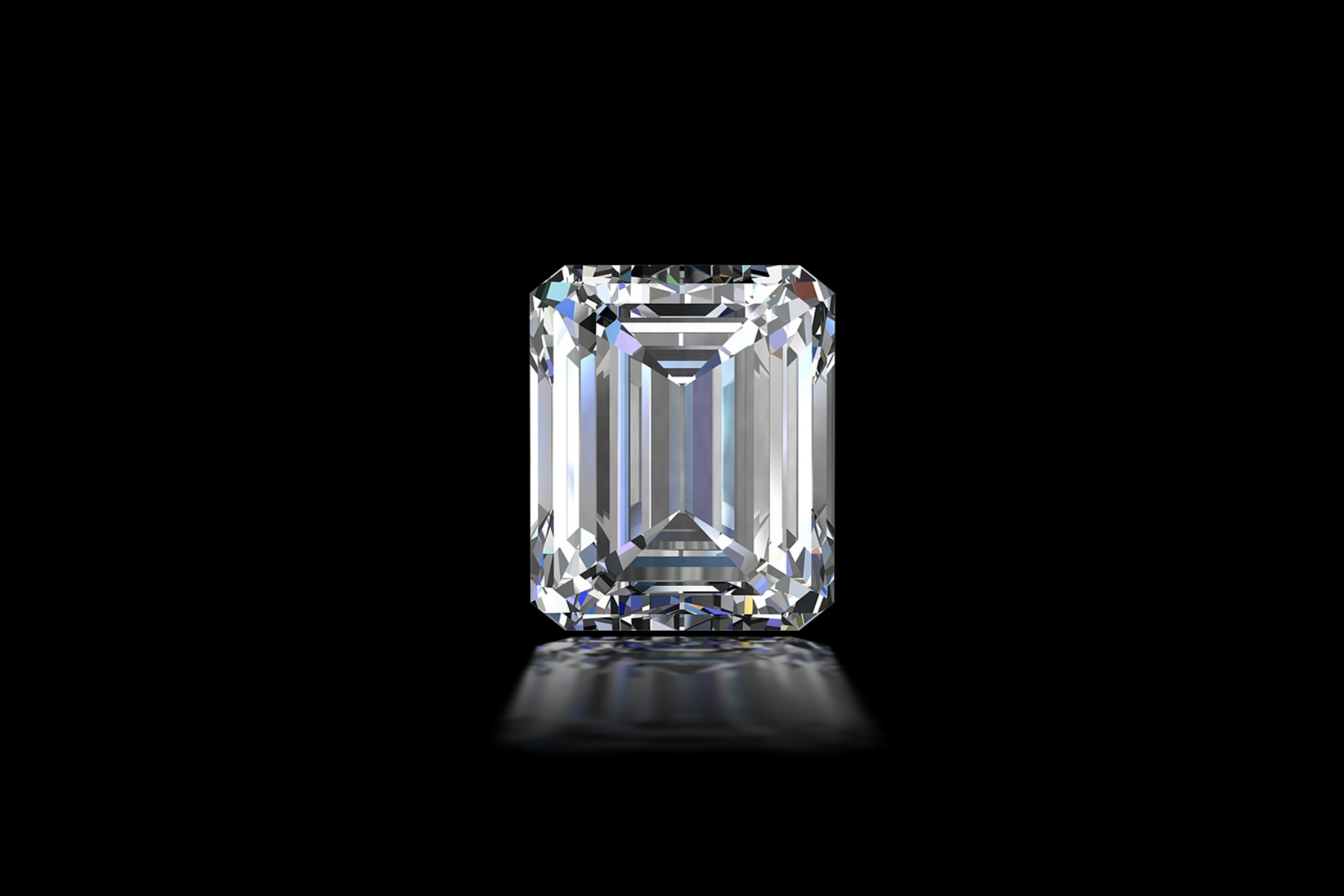 On a dark background, a white stone in an emerald cut
