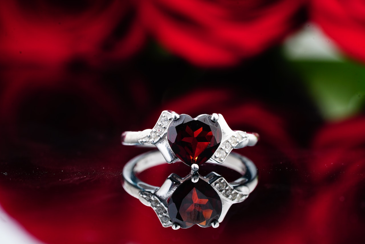 Elegant silver ring with red precious stone