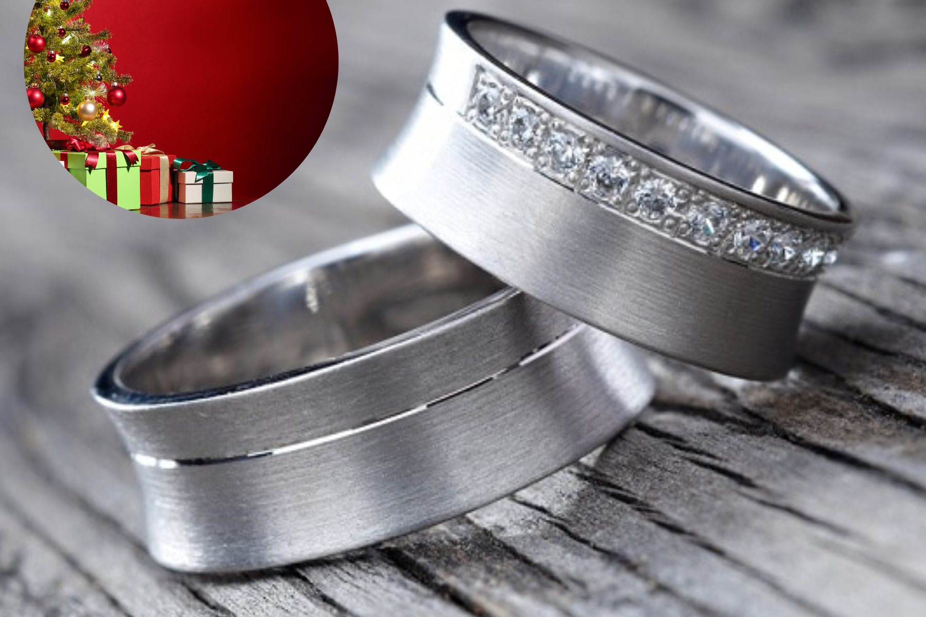 A pair of platinum rings adorned with a Christmas tree and presented in a gift box