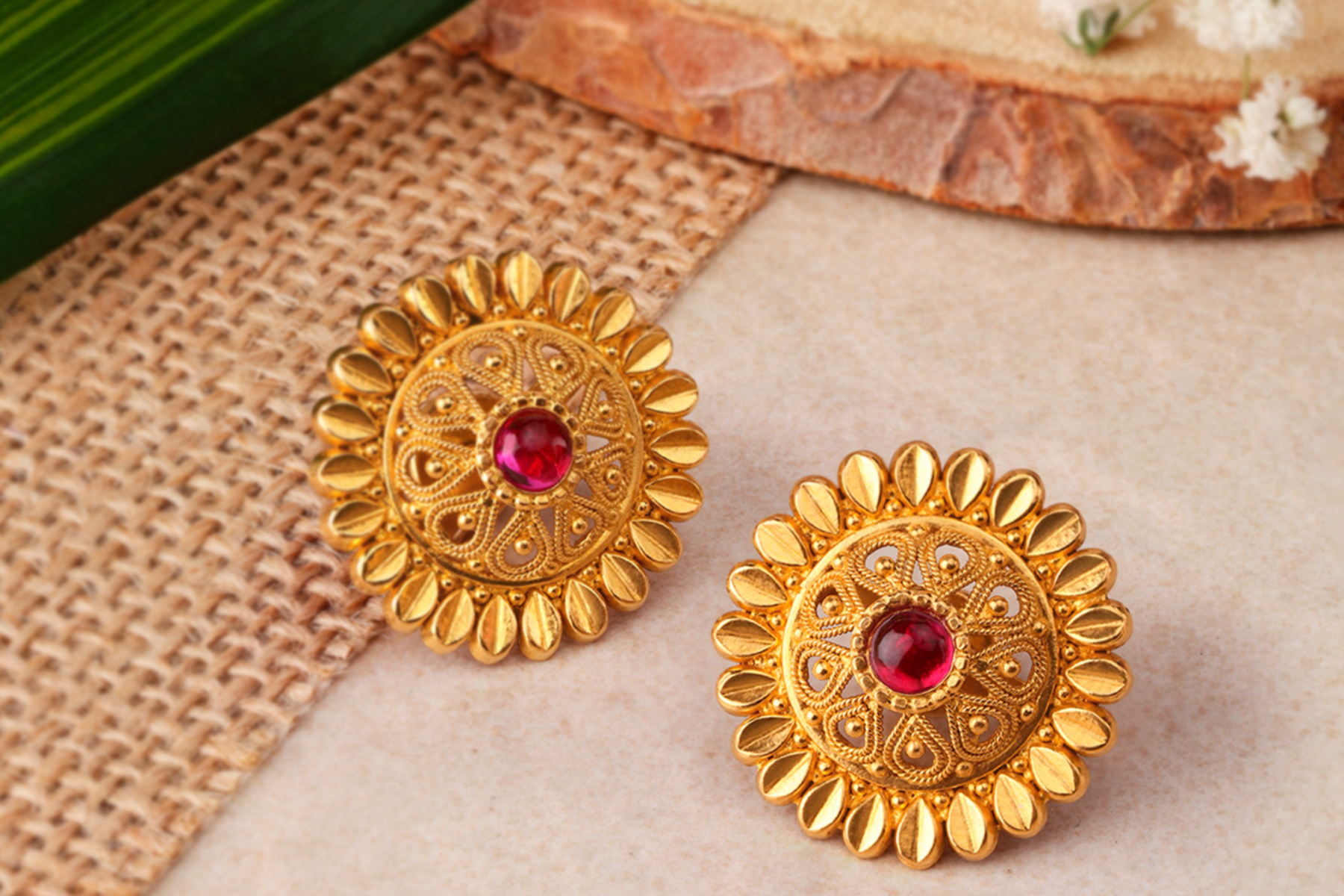 A pair of flower-shaped diamond earrings