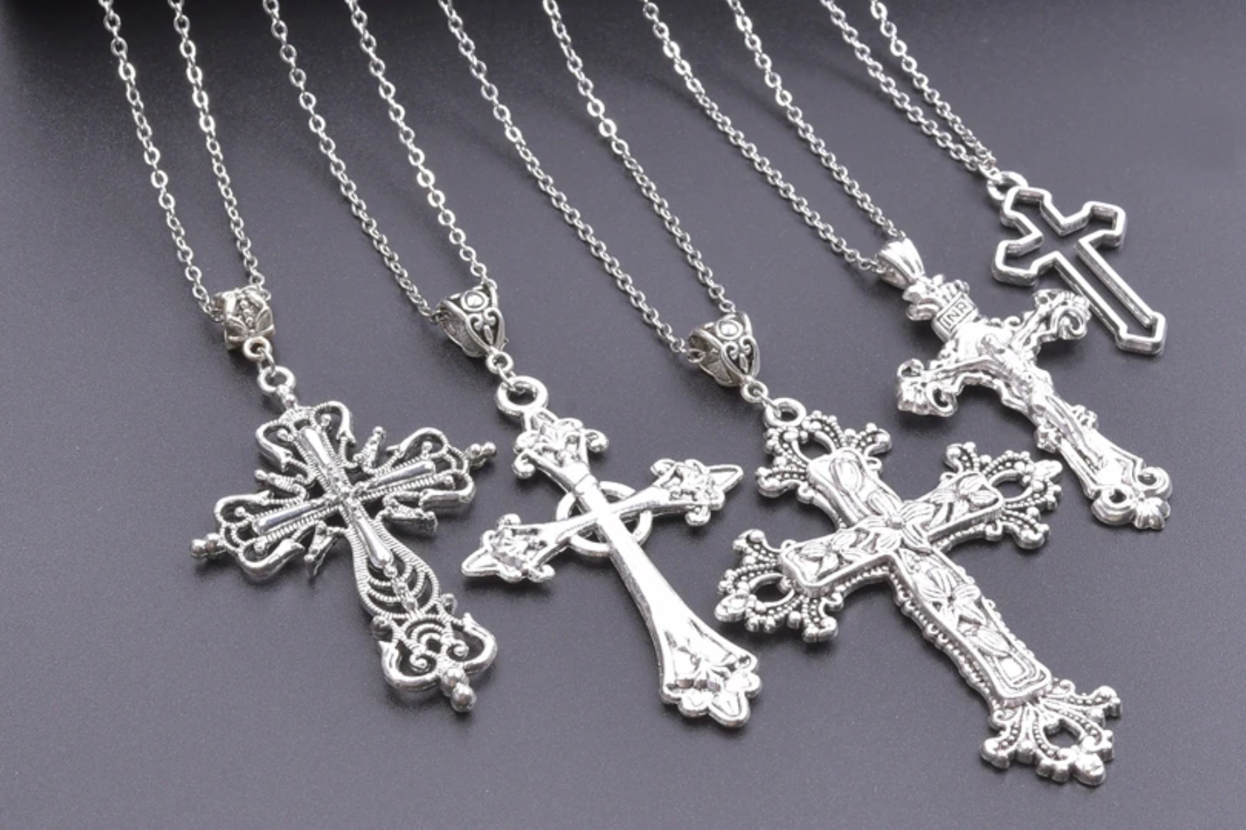 Five different types of cross religious pendant necklaces