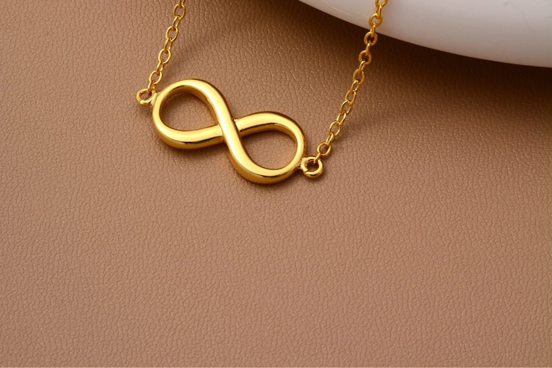 A gold infinity symbol