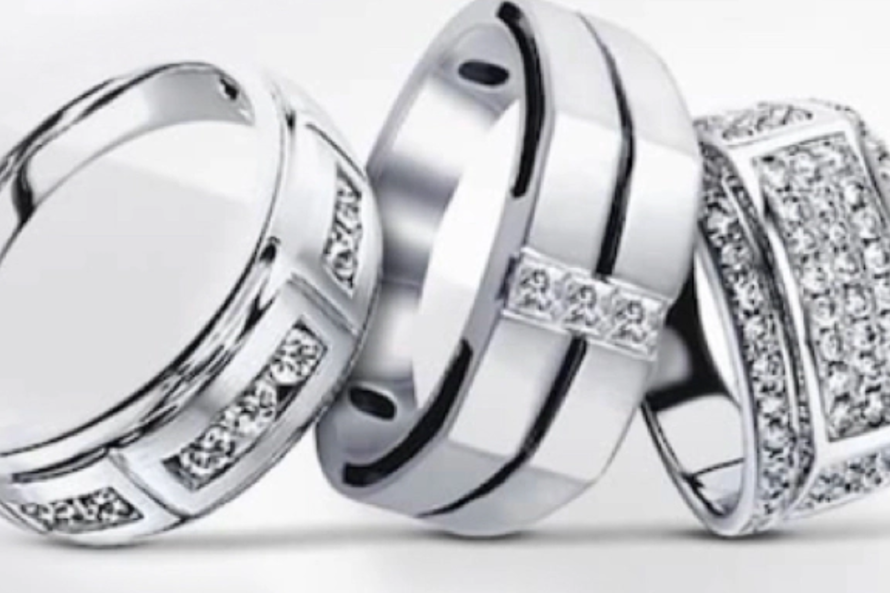 Three different styles of silver promise rings