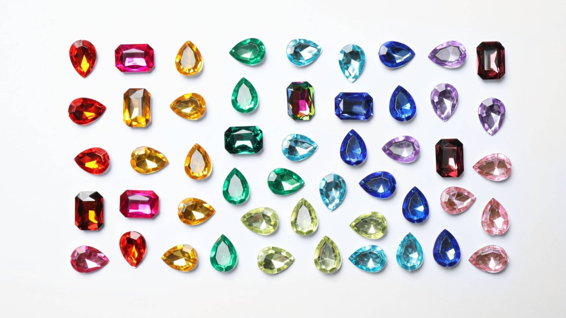 Different birthstones in various colors like red blue green and pink