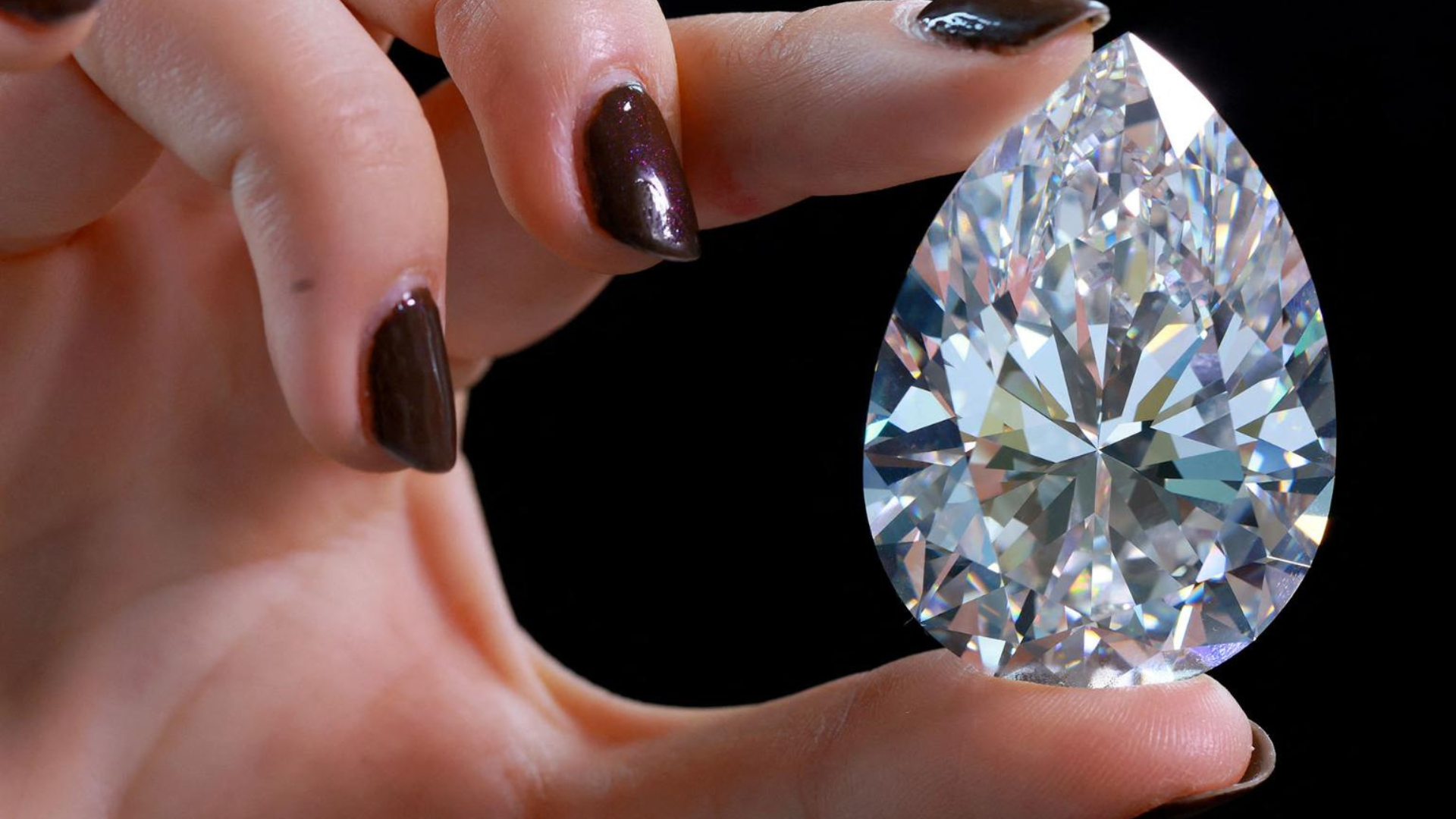 A person holding a diamond