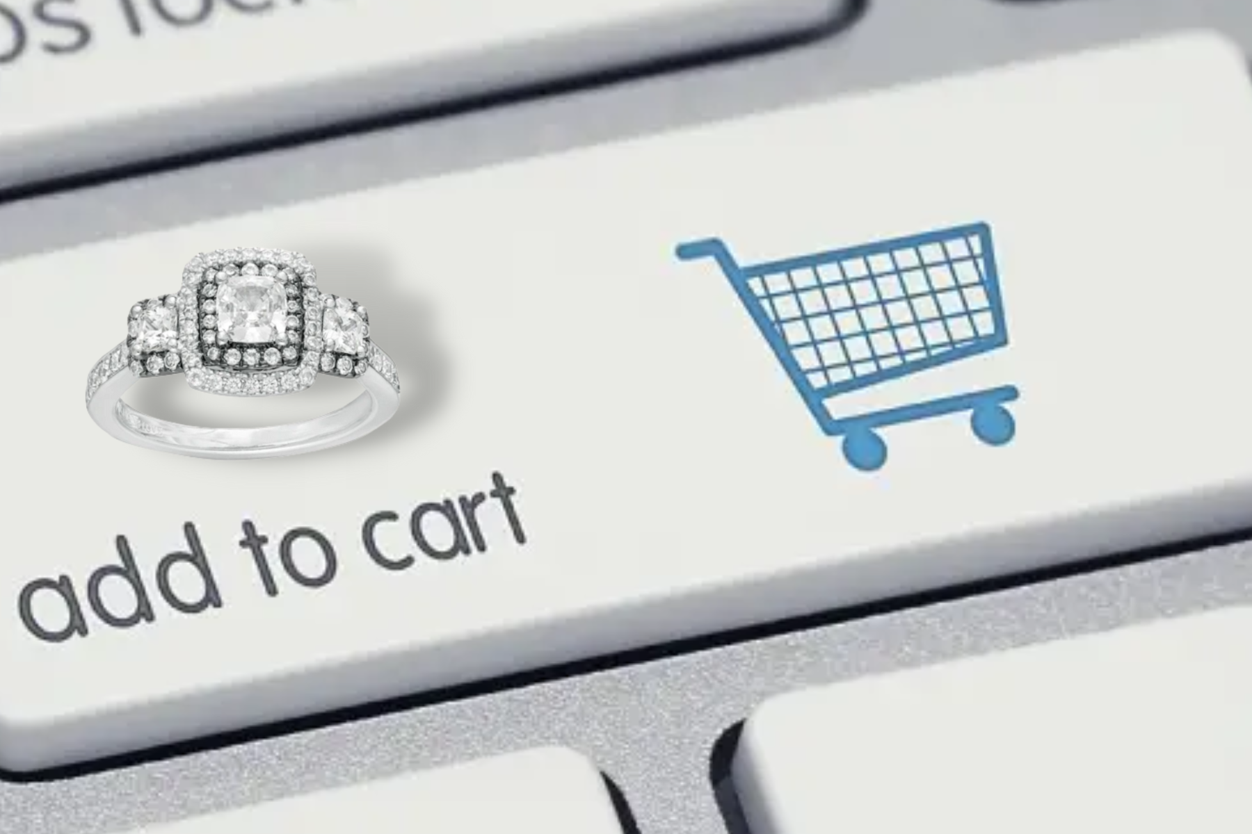 A cushion-cut diamond ring next to a "add to cart" keyboard button