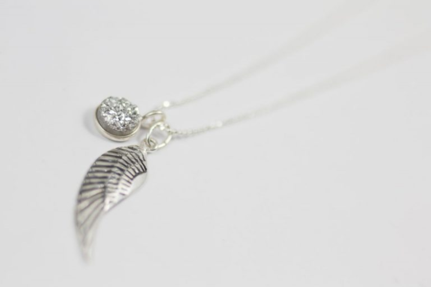 A necklace with silver angel wings