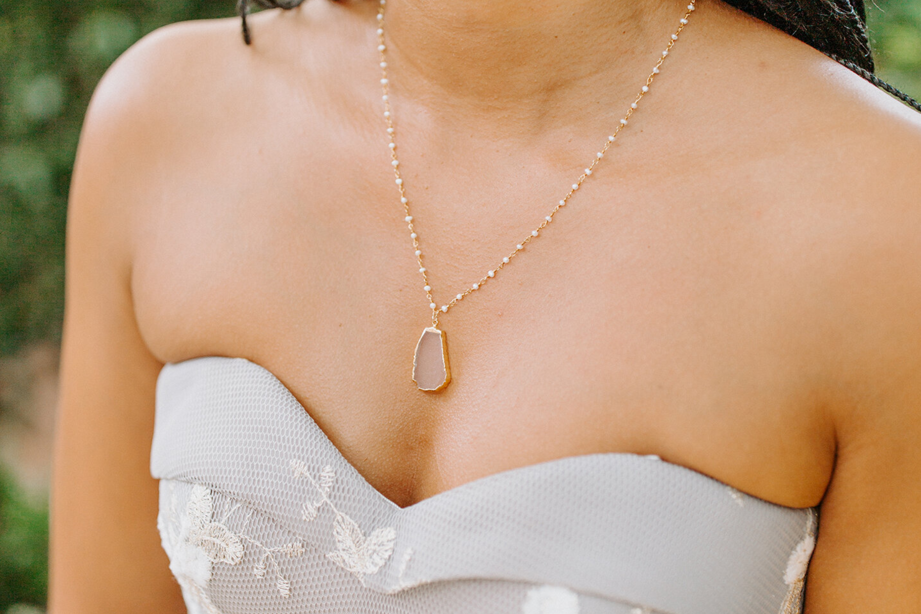 A bridesmaid with a platinum necklace