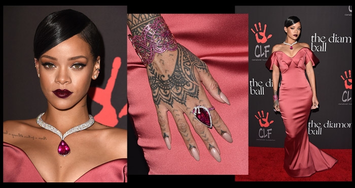 Rihanna wearing a tight pink dress with star ruby necklace and ring