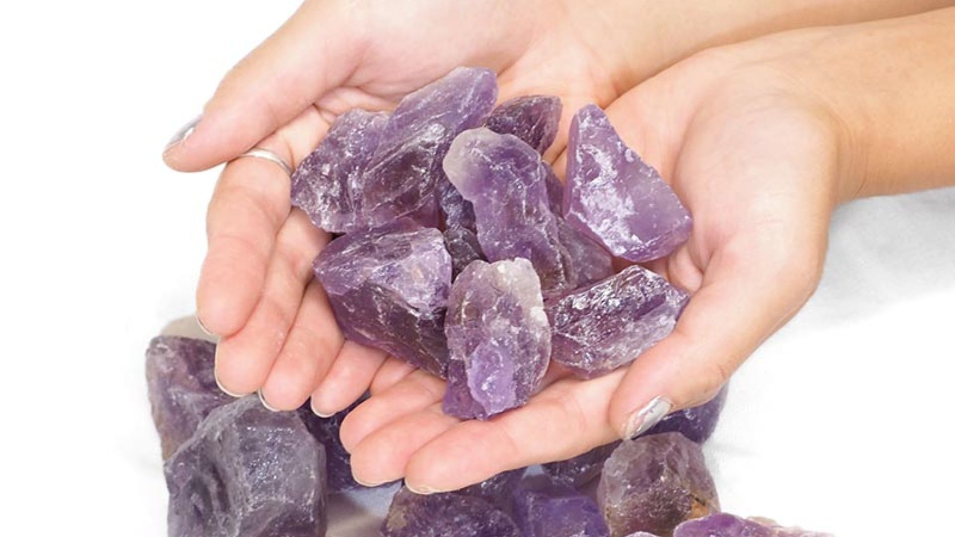 Holding Purple Color Stone In Hands