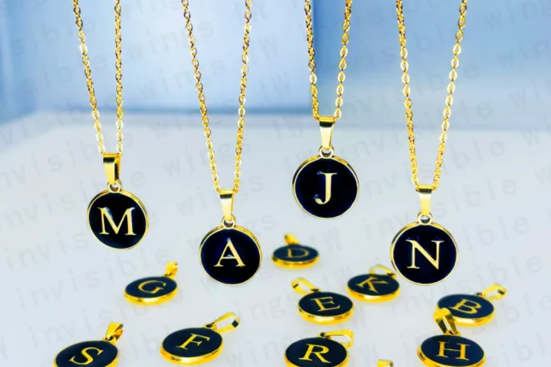 Thirteen necklaces with initials