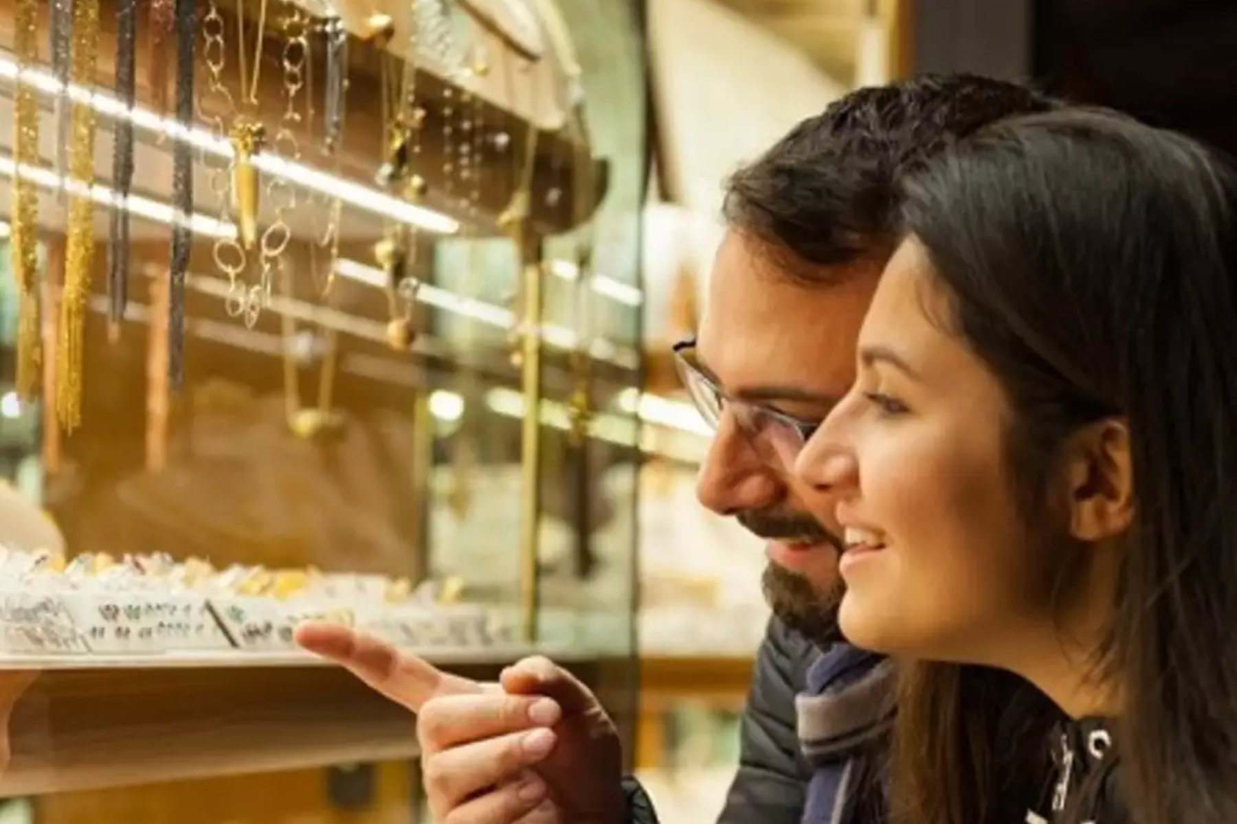 A couple selects diamond jewelry at a jewelry store