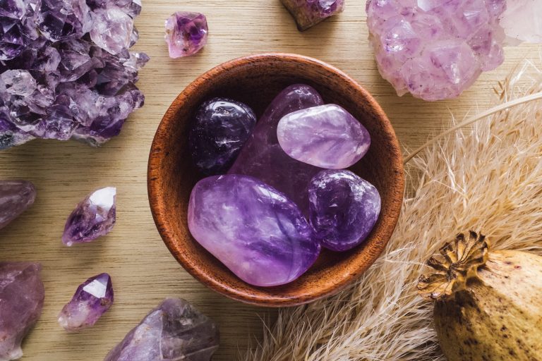 Amethyst crystals in a wooden bowl